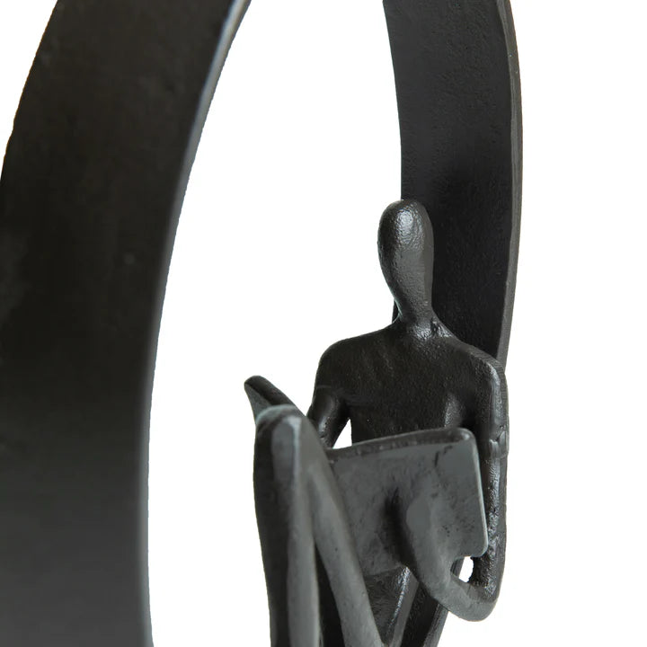 Encircled Reader Iron Sculpture